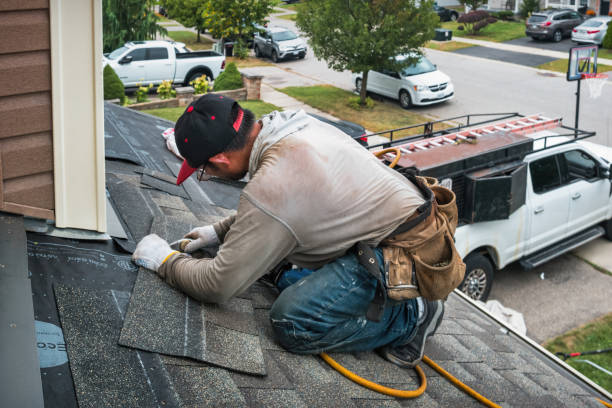Professional Roofing technician working in Hyde Park, MA